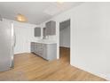 Modern kitchen with gray cabinets and white quartz countertops at 4321 Bobterry Ct, Charlotte, NC 28216