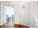 Bright foyer with hardwood floors, fresh paint, and decorative trimwork at 4918 Sunset Ridge Ct, Charlotte, NC 28269