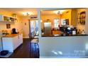 Modern kitchen with stainless steel appliances and breakfast bar at 4923 Park Rd # D, Charlotte, NC 28209