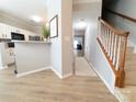 Bright hallway with hardwood floors and staircase leading upstairs at 4968 Sunburst Ln, Charlotte, NC 28213