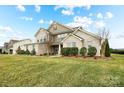 Charming home with white brick, siding, and a perfectly maintained lawn in a friendly neighborhood at 501 Alucio Ct, Matthews, NC 28104