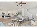 Spacious living area with an open floor plan connecting to a modern kitchen and dining area at 5812 Torrence St, Charlotte, NC 28269