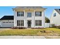 Two-story house with a white exterior, columns, and a two-car garage at 6518 Afterglow Dr, Indian Trail, NC 28079