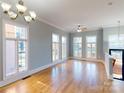 Spacious living area with hardwood floors and large windows at 701 N Church St # 9, Charlotte, NC 28202