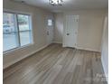 Spacious living area with hardwood floors and access to the front entrance at 757 Bilmark Ave, Charlotte, NC 28213