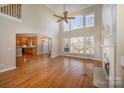 Spacious living room with hardwood floors, high ceilings, and a fireplace at 11805 Prestmoor Ct, Charlotte, NC 28262