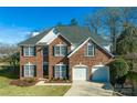 Two-story house with a large yard and driveway at 13234 Hidcote Ct, Huntersville, NC 28078