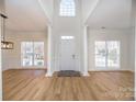 Two-story foyer with columns, wood floors, and natural light at 13234 Hidcote Ct, Huntersville, NC 28078