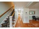 Bright entryway with hardwood floors, staircase, and view of kitchen at 161 Moore Haven Dr, Salisbury, NC 28147