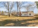 Backyard view of a ranch house with large yard at 1979 Charlotte Hwy, Mooresville, NC 28115