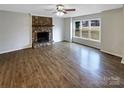 Living room with hardwood floors and a stone fireplace at 209 Vermont Dr, Stanley, NC 28164