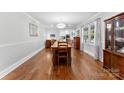 Bright dining room features hardwood floors and a view of the kitchen at 320 Belwood Dr, Belmont, NC 28012