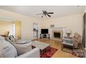 Living room with fireplace, hardwood floors, and neutral color palette at 3219 Monte Dr, Monroe, NC 28110