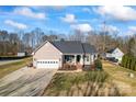 Single-story house with a yard, driveway, and detached shed at 489 Maple Ridge Cir, Salisbury, NC 28147