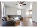 Living room with L-shaped sofa and hardwood floors at 604 E Louisiana Ave, Bessemer City, NC 28016