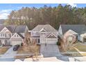 Charming two-story home featuring a two car garage, neutral colored exterior, and a cozy front porch at 79031 Ridgehaven Rd, Lancaster, SC 29720