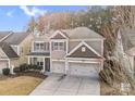 Charming two-story home featuring a two car garage, neutral colored exterior, and a cozy front porch at 79031 Ridgehaven Rd, Lancaster, SC 29720