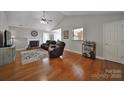 Spacious living room featuring a fireplace, hardwood floors, neutral paint colors, and vaulted ceilings at 849 Treva Anne Sw Dr, Concord, NC 28027