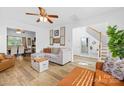 Cozy living room with hardwood floors, modern decor, and bright natural light at 10105 Bon Meade Ln, Cornelius, NC 28031