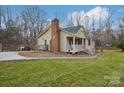 Charming single Gathering home featuring a inviting front porch and a well-maintained lawn at 1025 Twin Lakes Rd, Rock Hill, SC 29732