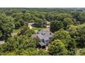 An aerial view of the home, with lush green landscaping surrounding the residence and neighborhood at 110 Lynbrook Dr, Davidson, NC 28036