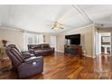 Spacious living room with hardwood floors, a fireplace, and leather furniture at 111 Green Dr, Richburg, SC 29729