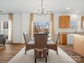 Breakfast nook with wicker chairs, glass top table, and view to the back yard at 1115 Ross Brook Trce, York, SC 29745