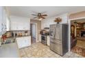 Bright kitchen with stainless steel appliances and white cabinets at 1318 Gum Branch Rd, Charlotte, NC 28214