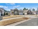 Beautiful exterior view of a well-maintained home with manicured lawn and lovely curb appeal at 132 Picasso Trl, Mount Holly, NC 28120