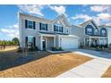 Beautiful two-story home with a two-car garage and well-kept lawn at 1433 Harleston St, Indian Trail, NC 28079