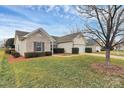 Charming one-story home with a well-manicured lawn and mature tree at 3134 Sterling Ct, Fort Mill, SC 29707