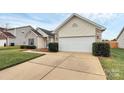 One-story home with a well-manicured lawn and attached two-car garage at 3134 Sterling Ct, Fort Mill, SC 29707