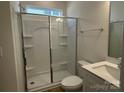 Clean bathroom with a large shower, toilet and a vanity with a quartz countertop at 6911 Fauna Dr # 60, Charlotte, NC 28215