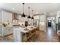 Modern kitchen with white cabinets, quartz countertops, and an island at 6911 Fauna Dr # 60, Charlotte, NC 28215