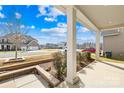 Front porch with white columns and view of neighborhood at 7405 Bosson Sw St, Concord, NC 28025