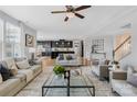 Spacious living room with hardwood floors and a view into the kitchen at 7405 Bosson Sw St, Concord, NC 28025