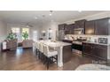 Modern kitchen with granite counters, dark cabinets, and island at 1206 Croft Dr # 98, Fort Mill, SC 29708