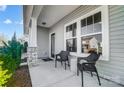 Inviting front porch with seating area, perfect for enjoying quiet moments outdoors at 128 Shay Crossing Rd, Salisbury, NC 28146