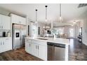 Bright kitchen with stainless steel appliances and an island that overlooks dining and living areas at 128 Shay Crossing Rd, Salisbury, NC 28146
