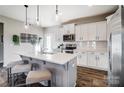 Modern kitchen features a large island, stainless steel appliances, and stylish pendant lighting at 128 Shay Crossing Rd, Salisbury, NC 28146