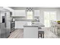 Open concept kitchen with island, granite countertops, and stainless steel appliances at 1525 39Th Avenue Ne Loop # 2, Hickory, NC 28601