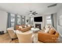 Spacious living room with a fireplace, hardwood floors, and comfortable seating at 15421 Keyes Meadow Way, Huntersville, NC 28078