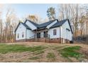 Low angle exterior image featuring the yard and brick-lined foundation at 252 Big Lick Rd, Stanfield, NC 28163