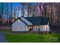 Charming exterior view showcasing the modern farmhouse design with black trim and inviting entrance at 252 Big Lick Rd, Stanfield, NC 28163