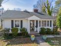 Close-up of a charming home featuring a welcoming entrance and well-maintained landscaping at 531 Elm St, Salisbury, NC 28144