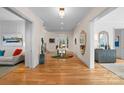 Bright entryway with hardwood floors, decorative accents, and views into adjacent rooms at 547 Cherokee Rd, Charlotte, NC 28207