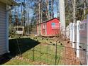 Wooden shed and swing set in fenced backyard at 630 Montgomery Dr, Rock Hill, SC 29732