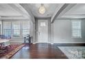 Bright foyer with hardwood floors, neutral paint, and a stylish light fixture at 109 Belfry Loop, Mooresville, NC 28117