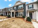 Attractive townhouse showcasing a tidy lawn and inviting entryway at 1108 Township Pkwy, Belmont, NC 28012