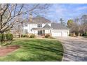 Charming two-story home with a three car garage and well-maintained landscaping at 115 Union Chapel Dr, Mooresville, NC 28117